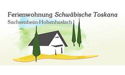Das Bild zeigt eine stilisierte Illustration eines Hauses mit zwei Bäumen davor, begleitet von der Aufschrift "Ferienwohnung Schwäbische Toskana Sachsenheim-Hohenhaslach."